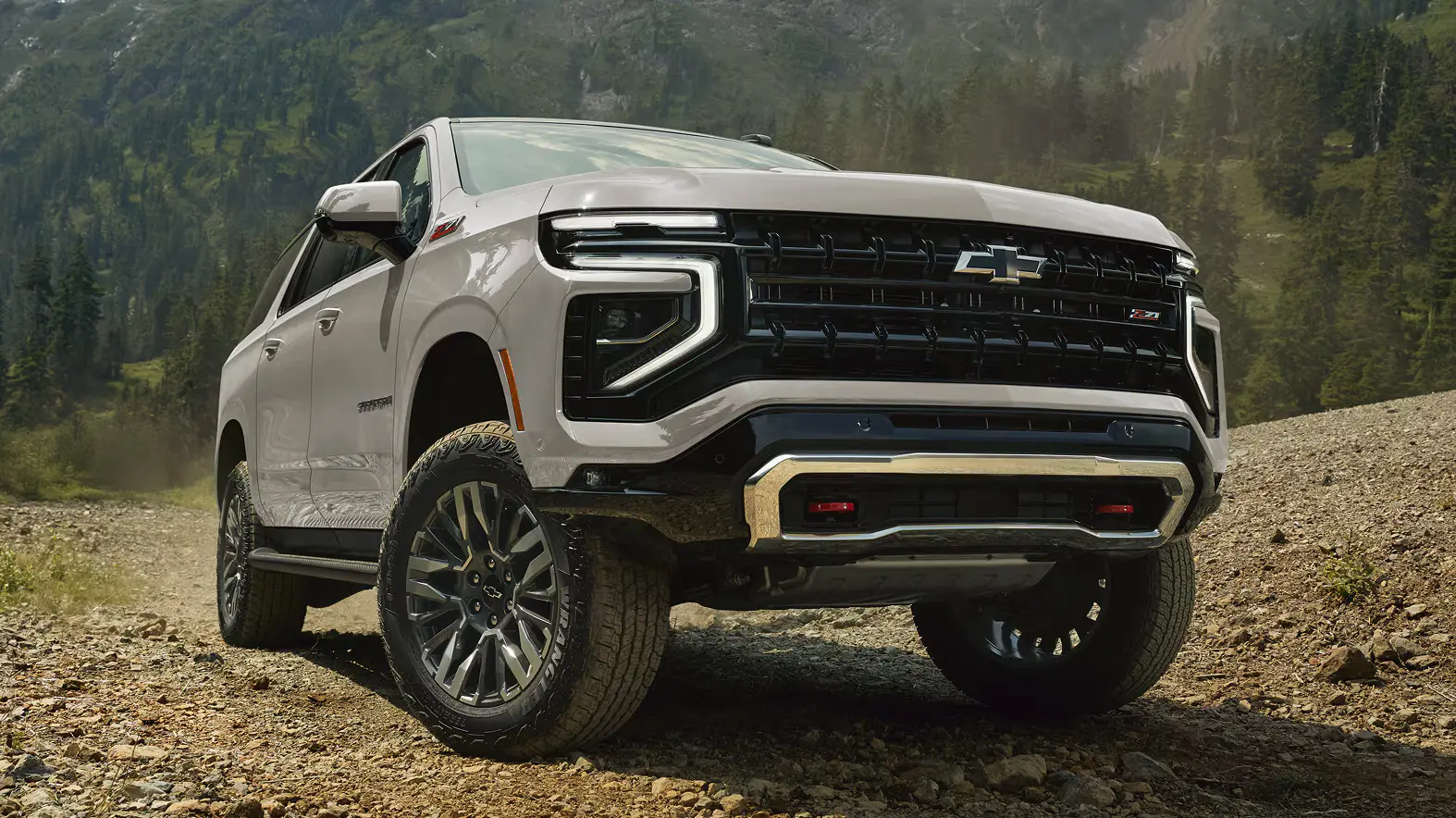 Chevrolet Suburban on a gravel mountain road