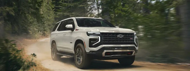 Chevrolet Tahoe Z71 on a dirt road through a forest