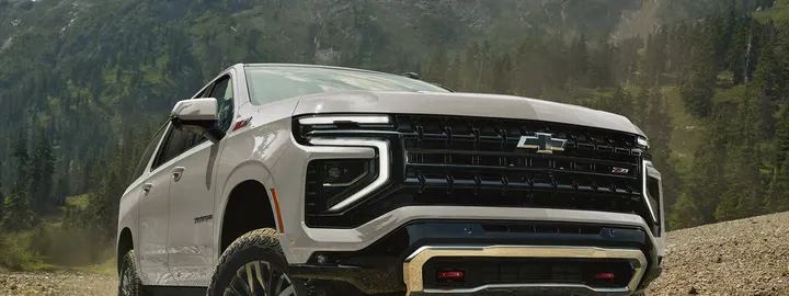 Chevrolet Suburban on a gravel mountain road