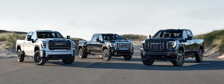 Three GMC Sierra HD pickups parked side by side