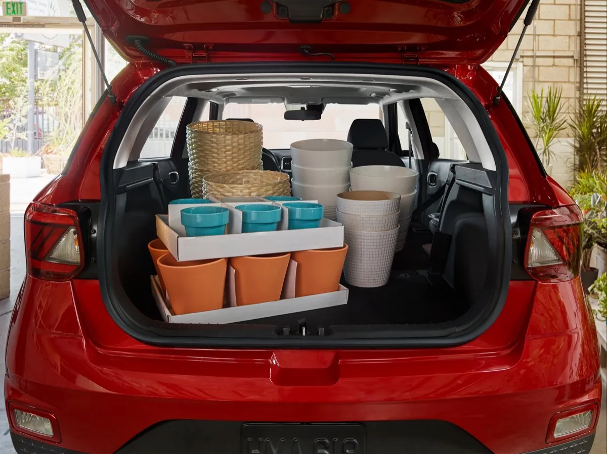 Cargo area of a red 2026 Hyundai Venue loaded with flower pots